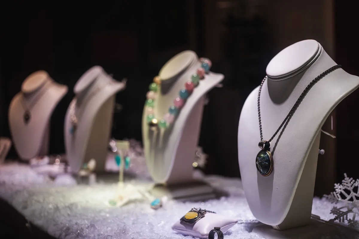 Luxurious necklaces displayed on mannequins in a jewelry store, reflecting future fine jewelry trends.