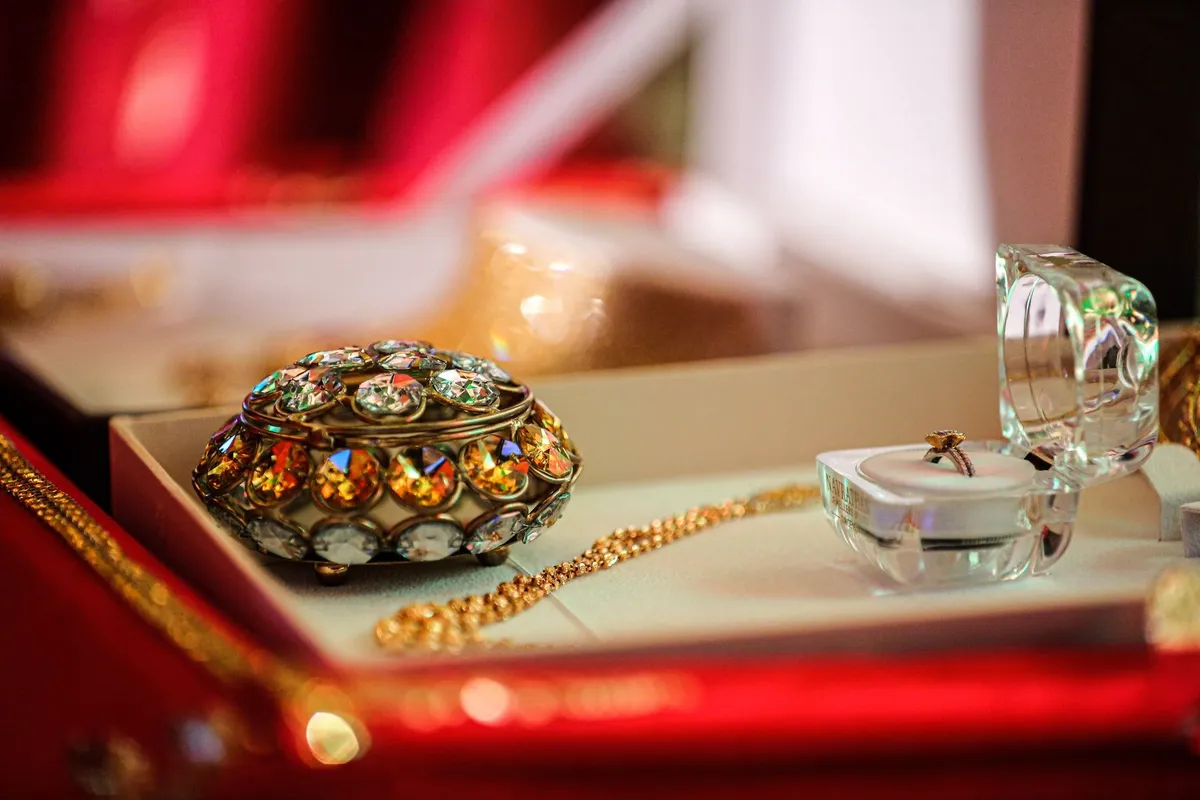 A luxurious jewelry box showcasing gold and jeweled accessories, highlighting the value of fine jewelry.